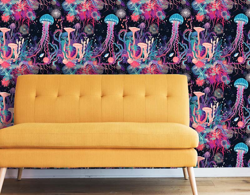 Jellyfish wallpaper on wall behind yellow couch