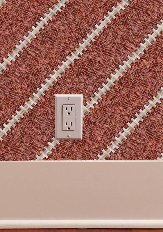 Football leather with laces wallpaper pattern on wall with trim and outlet