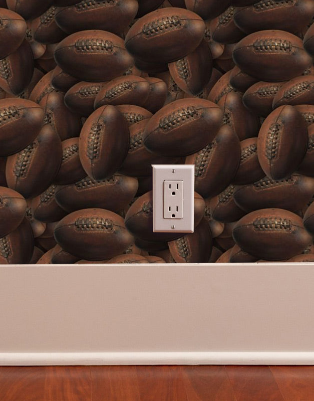 vintage football peel and stick wallpaper pattern sample image on wall with outlet, time and wood flooring
